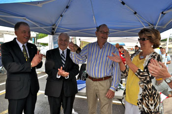 Photo of Secretary Fisher ringing the cowbell