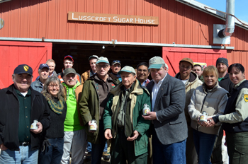 Photo of Secretary Fisher with officials at Lusscroft Farm