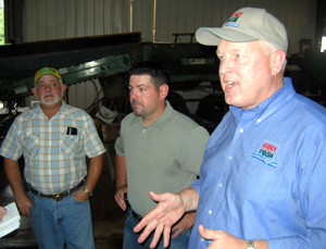 Photo of Russ Marino Sr., Joe Marino and Secretary Kuperus inside Sun Valley packing house