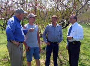 Photo of Secretary Kuperus, Ken Harris Jr., Ken Harris Sr. and Assemblyman Doug Fisher