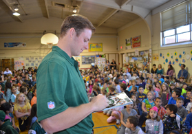 Photo of Jets Quarterback Greg McElroy signing a program in Brick Township - Click to enlarge
