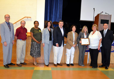 Photo of McKnight School officials accepting the HUSSC Award
