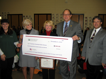 Photo of check presentation to Osage Elementary School