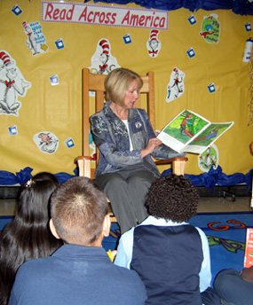 Photo of Pat Dombroski of USDA reading to students in Perth Amboy