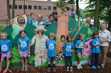 Photo of officials with the pest display