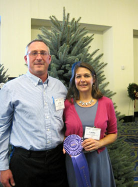 Photo of John and Leslie Wyckoff and their winning Christmas Tree