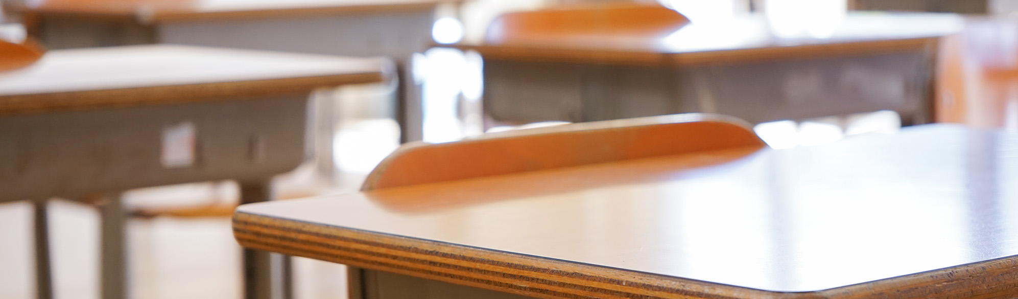 A school desk in an empty classroom