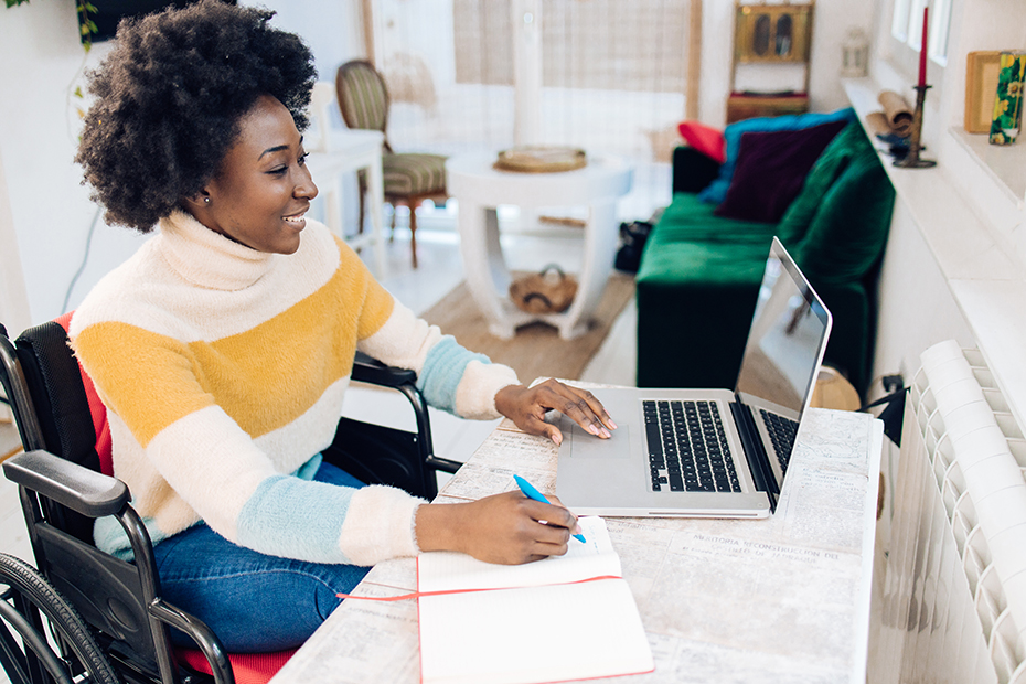 Woman reading a laptop