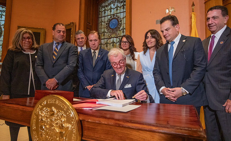 New Jersey Governor signing documents