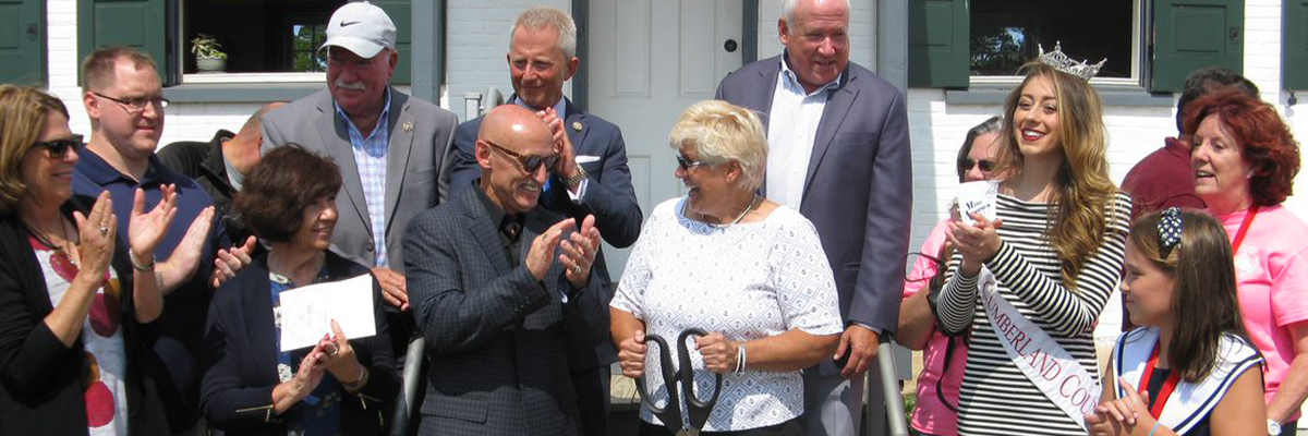 Ribbon Cutting Ceremony with People Clapping : Photo