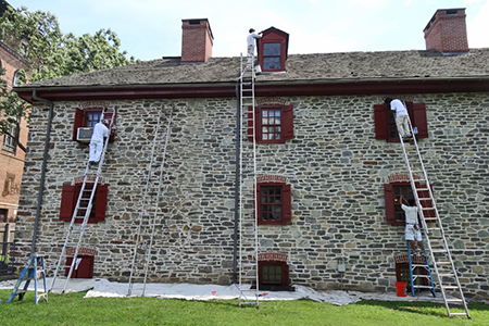 Workers fixing windows