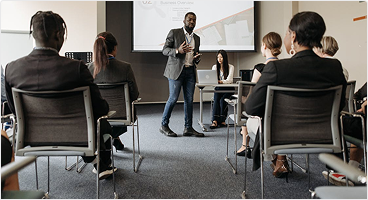 Visual of a consultant presenting to a group of people