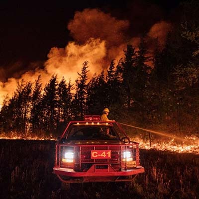 The New Jersey Forest Fire Service works to suppress flames during the Big Timber Fire in Winslow Township
