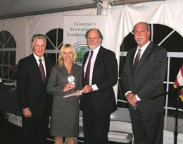 Christine Weydig of the Port Authority of New York & New Jersey receiving an Innovative Technology Environmental Excellence Award from Governors Florio and Corzine and NJDEP Acting Commissioner Mauriello.