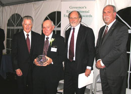 Dr. John J. Kirk receiving an Environmental Excellence Award for Environmental Leadership from Governors Florio and Corzine and NJDEP Acting Commissioner Mauriello.