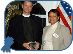 NJDEP Commissioner Lisa Jackson awards the Governor's Environmental Excellence Award for Environmental Leadership to Reverend Fletcher Harper, Executive Director of GreenFaith for his leadership in promoting clean energy, energy conservation, green building, water conservation and environmental protection to the faith-based community.