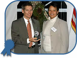 NJDEP Commissioner Lisa Jackson awards the Governor’s Environmental Excellence Award for Environmental Leadership to Dr. Kevin Lyons, Director of Purchasing at Rutgers University for his applied research and implementation of environmentally-friendly and socially-responsible purchasing at the University.