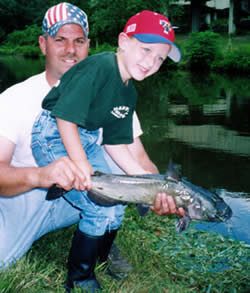 Father, son and channel cat at D&R Canal