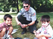 Officer with two children
