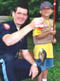 Officer, youngster and fish