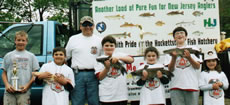 Youngsters with fish and trophy