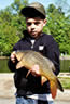 Boy with large carp