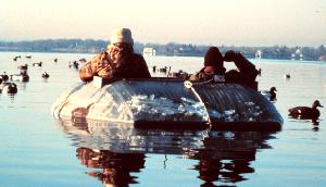 Duck hunters on the water