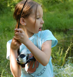 Excited girl with fish on