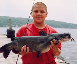Youth with channel catfish
