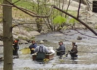 Crew working below dam