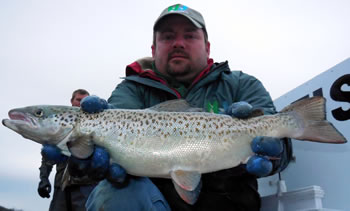 Hatchery worker Jim Hartobey with salmon