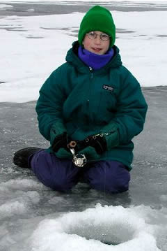 Boy ice fishing