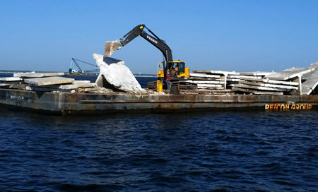 Concrete being deployed from barge