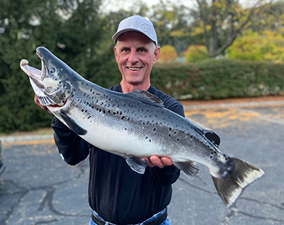 Joe Satkowski Holding Landlocked Atlantic Salmon