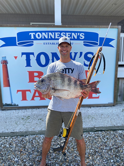 Joe Satkowski Holding Landlocked Atlantic Salmon