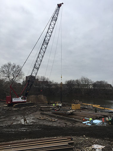 Coffer dam installation at mouth of kayak channel in Cooper River