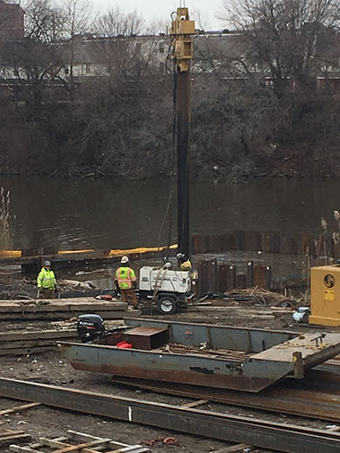 Coffer dam installation at mouth of kayak channel in Cooper River