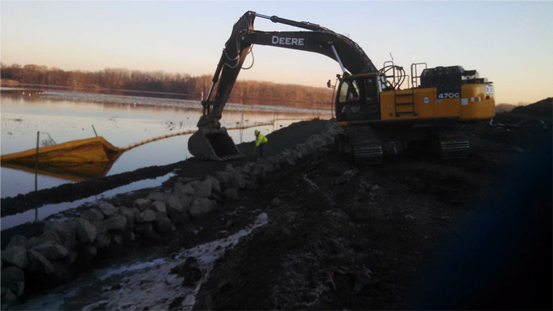 photo-Heavy equipment constructing shoreline stabilization