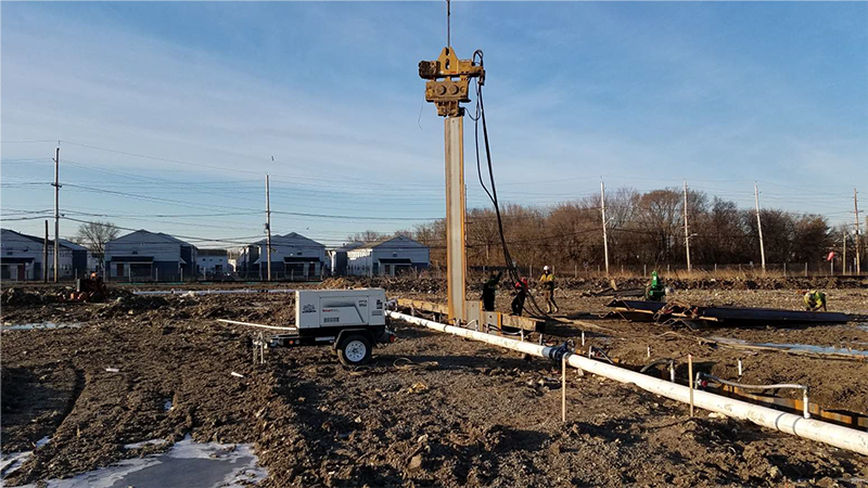 Installation of steel sheet pile for fihsing pond weir