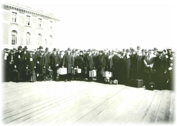 A large group of immigrants arriving in their new home.  