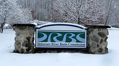 Delaware River Basin Sign in snow.