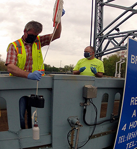 DRBC staff collects a surface water sample to monitor for 1,4-Dioxane. Photo by DRBC.