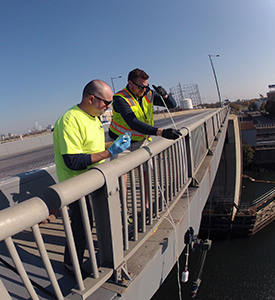 DRBC staff collects a surface water sample to monitor for 1,4-Dioxane. Photo by DRBC.