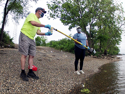 DRBC staff collect a water sample to monitor bacteria levels. Photo by DRBC.