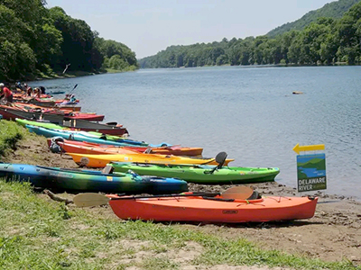 Boats are lined up along the Delaware River. Photo courtesy of the Delaware River Sojourn.