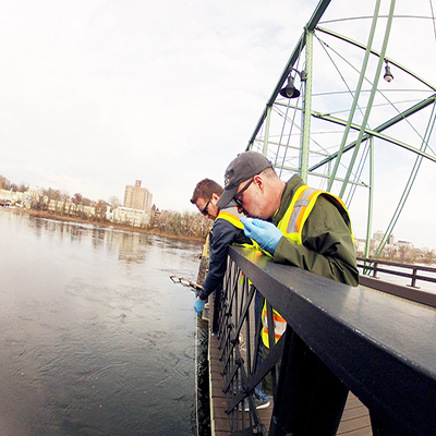 DRBC staff collect a water sample to monitor for 1,4-Dioxane. Photo by the DRBC.