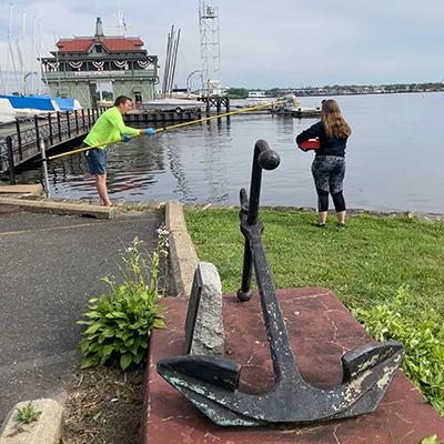 DRBC staff collect a water sample to monitor bacteria concentrations. Photo by the DRBC.