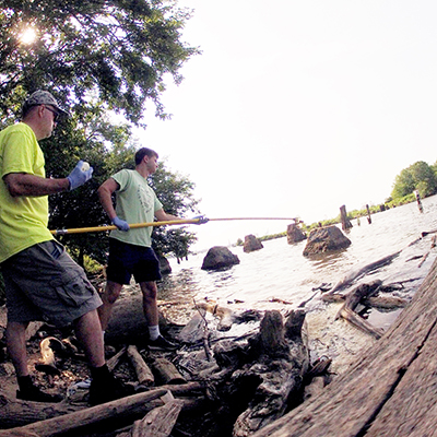 DRBC staff collect a water sample to perform Microbial Source Tracking (MST). Photo by the DRBC.