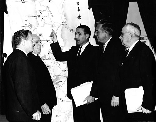 On December 13, 1961, the historic first meeting of the Delaware River Basin Commission was held in Princeton, N.J. Shown attending this meeting are, left to right, New York Gov. Nelson Rockefeller, Pennsylvania Gov. David Lawrence, Interior Secretary Stewart Udall, New Jersey Gov. Robert Meyner, and Alternate Delaware Commissioner Norman Lack. Its mission achieved, the Delaware River Basin Advisory Committee was dissolved, although two of its staff members would later move into key DRBC positions -- William Miller as General Counsel and W. Brinton Whitall as Secretary.