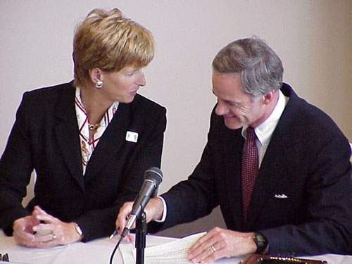 Delaware Governor Thomas R. Carper signs the resolution calling for a new comprehensive water resources plan for the basin as New Jersey Governor Christine Todd Whitman looks on. The signing ceremony took place during a Governors' Summit held on Sept. 29, 1999 at the New Jersey State Aquarium (now known as Adventure Aquarium) in Camden.